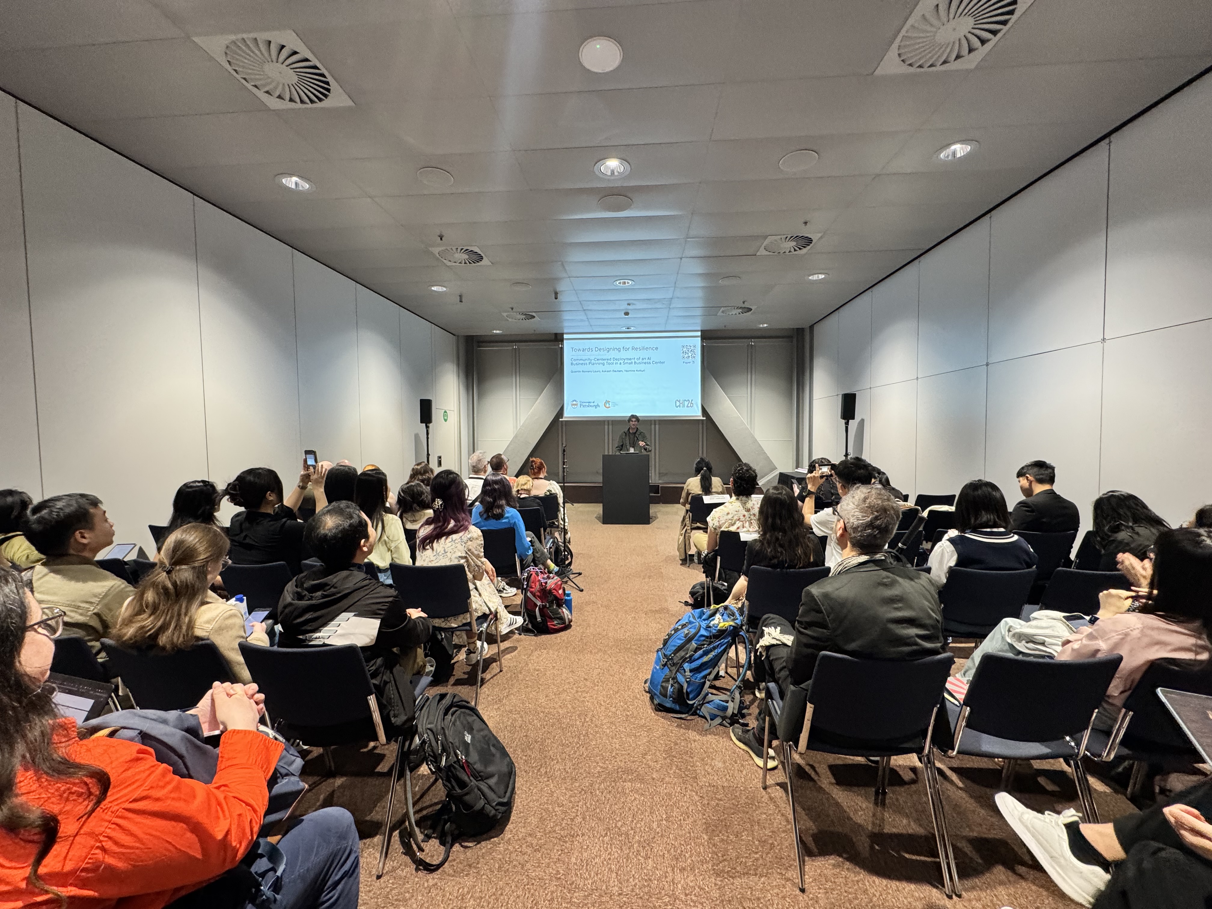Quentin Romero Lauro presenting BizChat at CHI 2026